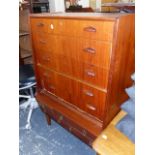 A RETRO TEAK CHEST OF DRAWERS AND A SWIVEL CHAIR.