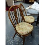 A SET OF FOUR ERCOL DINING CHAIRS.