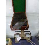 AN UNIS PARIS STEREOSCOPIC VIEWER TOGETHER WITH A MAHOGANY BOX OF VERASCOPE RICHARD GLASS SLIDES.