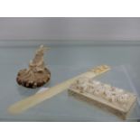 A EUROPEAN IVORY FLORAL CARVED BOX. W.6cms, A PAGE MARKER CARVED WITH A GRAPE HANDLE, H.14cms, AND A