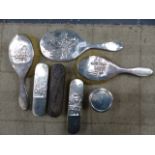 A FIVE PIECE SILVER BACKED DRESSING TABLE SET, AN EBONY BACKED CLOTHES BRUSH AND A SILVER TOPPED