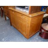 AN ARTS AND CRAFTS STYLE LOW SIDE CABINET AND A TWO DRAWER CHEST.