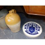 A WILLIAM RILEY FLAGON AND A HUNT EDMONDS WALL PLAQUE.