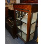 A DISPLAY CABINET.