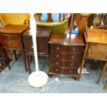 THREE MAHOGANY BEDSIDE TABLES, A MINIATURE CHEST OF DRAWERS AND A STANDARD LAMP.