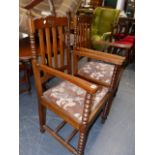 A SET OF SIX OAK DINING CHAIRS WITH BOBBIN TURNED DECORATION.