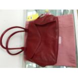 A RED LEATHER RADLEY LONDON BAG.