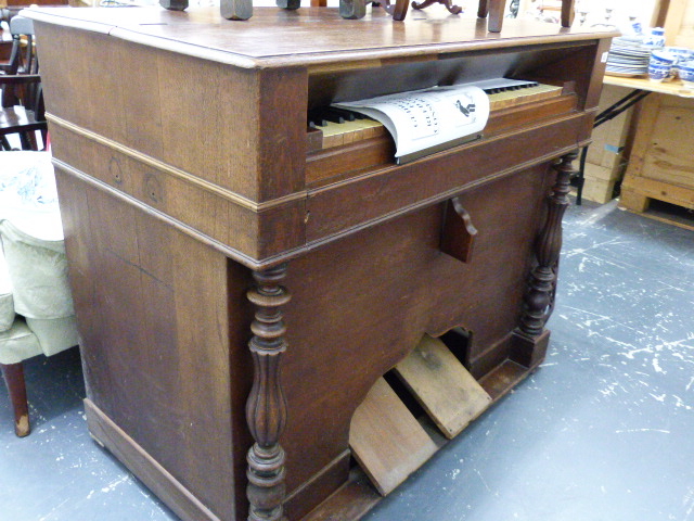 A LARGE LATE VICTORIAN HARMONIUM.