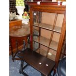 A DISPLAY CABINET AND TWO OCCASIONAL TABLES.