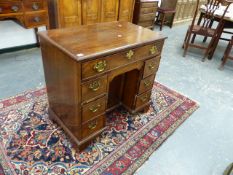 A GEO.III. AND LATER MAHOGANY KNEEHOLE DESK WITH A LONG DRAWER OVER THE KNEEHOLE CUPBOARD FLANKED BY
