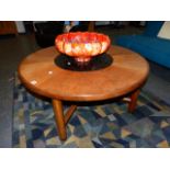 A G-PLAN TEAK COFFEE TABLE WITH INSERT GLASS CENTRE. Dia.97cms.