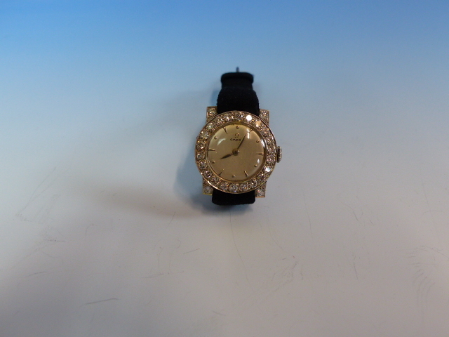 A LADIES PLATINUM AND DIAMOND WATCH FITTED WITH A VINTAGE OMEGA MANUAL WOUND MOVEMENT. THE INSIDE - Image 18 of 18