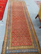 AN ANTIQUE PERSIAN TRIBAL RUNNER. 312 x 103cms.