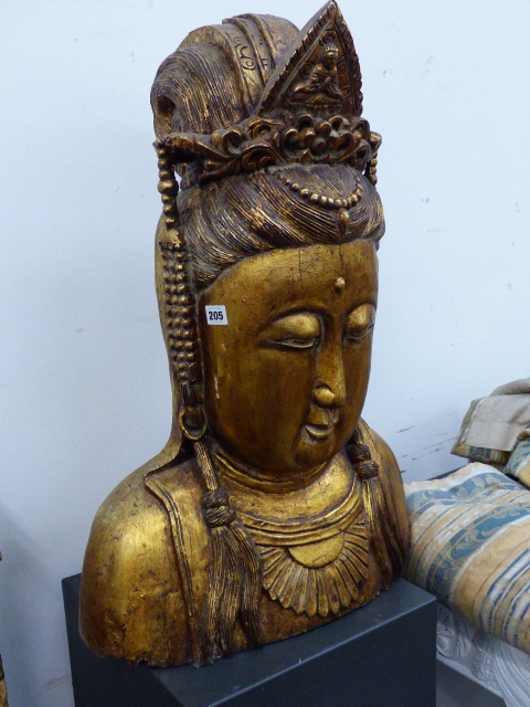 A GOLD LACQUERED WOOD HEAD OF GUANYAN WEARING A JEWELLED DIADEM AND A HALF DAISY HEAD PENDANT. H.