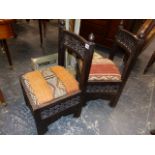 A PAIR OF INDO-ASIAN HARDWOOD LOW CHAIRS, THE KELIM DROP IN SEATS ABOVE MISHRABIYA LATTICE WORK