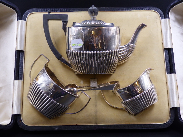 A CAMPBELL & LUMBY CASED SILVER THREE PIECE TEASET, THE HALF GADROONED TEA POT AND CREAM JUG,