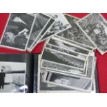 AN ALBUM CONTAINING VARIOUS THIRD REICH STAMPS, POST CARDS AND RLB IDENTITY DOCUMENTS.