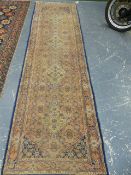 AN ORIENTAL RUNNER OF PERSIAN TABRIZ DESIGN. 300 x 87cms.