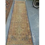 AN ORIENTAL RUNNER OF PERSIAN TABRIZ DESIGN. 300 x 87cms.