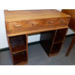 A 20th.C.OAK DESK IN THE MANNER OF HEALS WITH TWO APRON DRAWERS BELOW THE RECTANGULAR TOP AND WITH