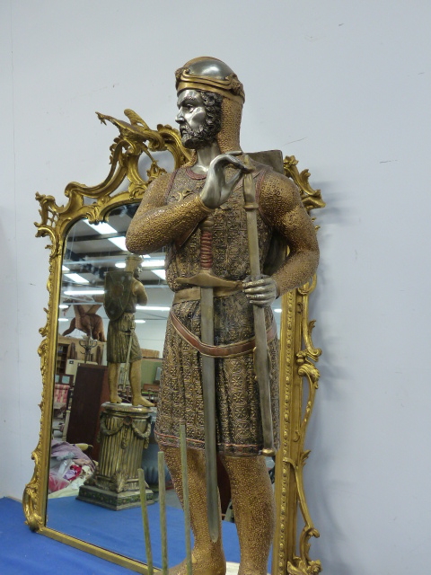 A PAIR OF GILT AND SILVERED BRONZE FIGURES OF FRENCH KNIGHTS STANDING ON SWAGGED COLUMNS