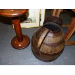 AN OAK BREAD OVEN PADDLE, AN IRON COOPERED OAK JUG. H.38cms AND A TREEN SPOOL. W.41cms. (3)