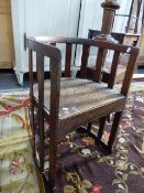 AN ARTS AND CRAFTS MAHOGANY CHAIR, IN THE MANNER OF LIBERTYS .THE HALF ROUND TOP RAIL AND FOOT