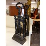 A PAIR OF ANTIQUE CAST IRON DOORSTOPS IN THE FORM OF STANDING KNIGHTS. H.45cms.