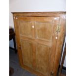 A 19tH.C.PINE CORNER CABINET WITH SINGLE FOUR PANEL DOOR. W.104 x H.108cms.