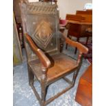 AN 18th.C.AND LATER OAK WAINSCOT CHAIR WITH CARVED CREST RAIL.