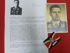 OTTO WEISS SIGNED PHOTOGRAPH AND OAK LEAVES TO THE KNIGHTS CROSS, LETTER OF PROVENANCE.