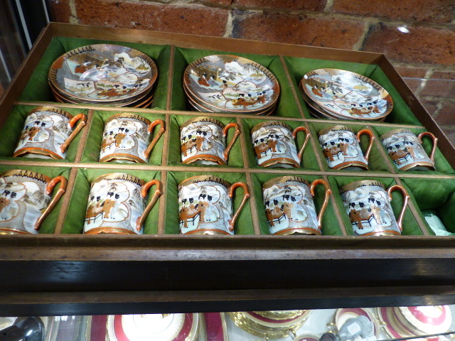 A WOODEN CASED PART SET OF KUTANI EGSHELL COFFEE CANS AND SAUCERS.