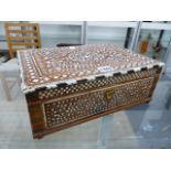 AN INDIAN IVORY FLORAL INLAID BOX, THE HINGED RECTANGULAR LID EDGED IN EBONY ALTERNATING WITH