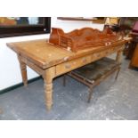 A LATE 19th.C.PINE LARGE SCULLERY TABLE WITH HEAVY PLANK TOP OVER THREE FRIEZE DRAWERS ON TURNED