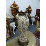 A FLORAL DECORATED PORCELAIN BALUSTER VASE MOUNTED WITH FOLIATE BRONZE HANDLES, RIM AND FOOT. H.