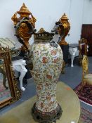 A FLORAL DECORATED PORCELAIN BALUSTER VASE MOUNTED WITH FOLIATE BRONZE HANDLES, RIM AND FOOT. H.