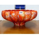 A RETRO RED LAVA GLAZED POTTERY BOWL. Dia.39cms.