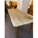 AN ANTIQUE RUSTIC PINE LARGE SCULLERY TABLE. W.275cms.