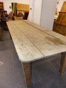 AN ANTIQUE RUSTIC PINE LARGE SCULLERY TABLE. W.275cms.