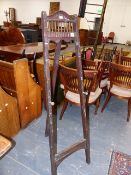 A MAHOGANY EASEL, THE PEGS ADJUSTING THE PICTURE HEIGHT BY FIVE HOLES. H.138.5cms.