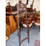 A MAHOGANY EASEL, THE PEGS ADJUSTING THE PICTURE HEIGHT BY FIVE HOLES. H.138.5cms.