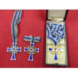 THIRD REICH MOTHER'S CROSS IN GOLD AND FURTHER EXAMPLES IN SILVER AND BRONZE, THE GOLD EXAMPLE,