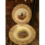 A PAIR OF ROYAL WORCESTER PLATES, DATE CODES FOR 1901, THE INTERIORS PAINTED WITH BLACK GAME AND