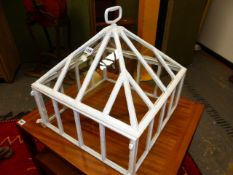 A GLAZED WHITE PAINTED IRON CLOCHE WITH HANDLE TOPPED LIFT OFF PYRAMIDAL COVER. 45 x 45cms.