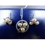 AN 18ct WHITE GOLD DIAMOND AND PEARL PENDANT AND EARRING SET. THE BRILLIANT CUT CENTRE DIAMOND