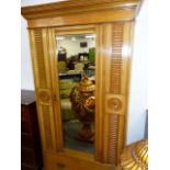 A VICTORIAN ASH WARDROBE WITH SINGLE MIRROR DOOR OVER DRAWERS AND PLINTH BASE. 106 x 59 x H.208cms.