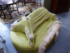 A LIME UPHOLSTERED OVAL CONVERSATION SEAT, THE LONG SIDES WITH BACK TO BACK SETTEES TO SIT TWO