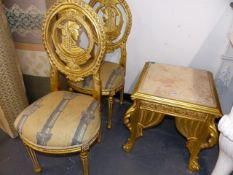 A PAIR OF EGYPTIAN STYLE GILTWOOD SIDE CHAIRS WITH PHAROAH ROUNDEL BACKS
