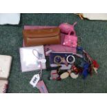 TWO TINY RADLEY PURSES, FIVE KEY RINGS/ RADLEY CHARMS, A BOOKMARK AND A SPECTACLES CASE.