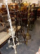 FOUR LATE 19th.C.WROUGHT IRON AND BRASS STANDARD LAMPS. (4)